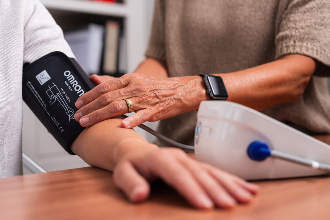 Home blood pressure measurement with digital blood pressure monitor and physician assistant.